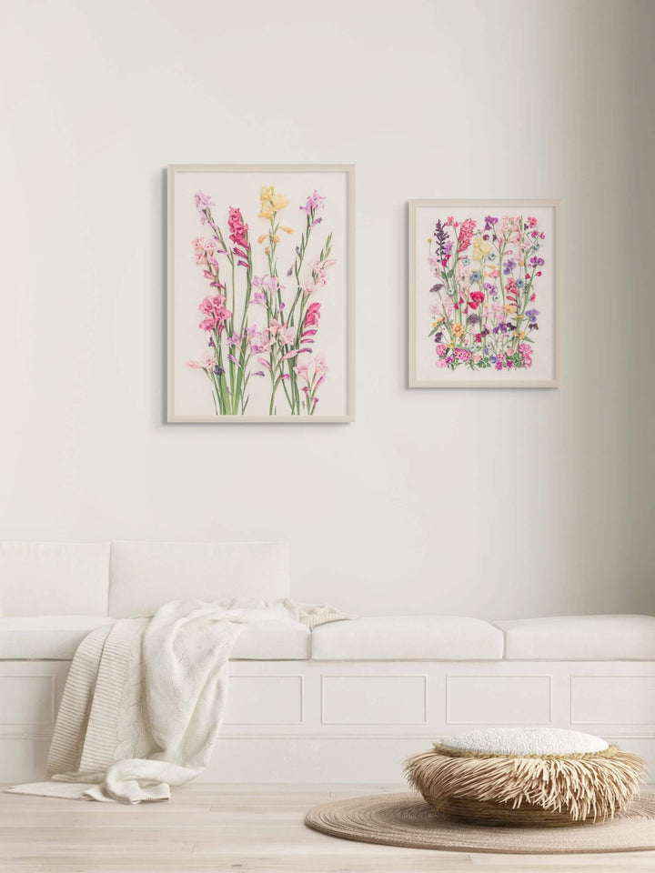 Floral prints in two sizes in white room