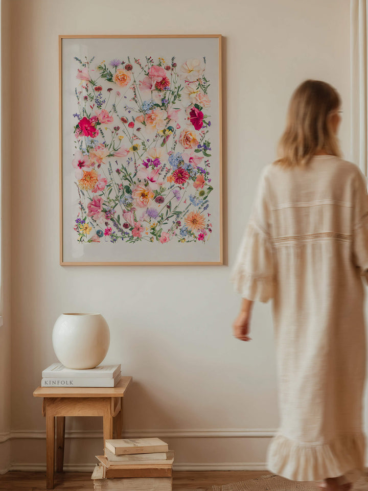 Woman walking past print The Fig and Olive Garden